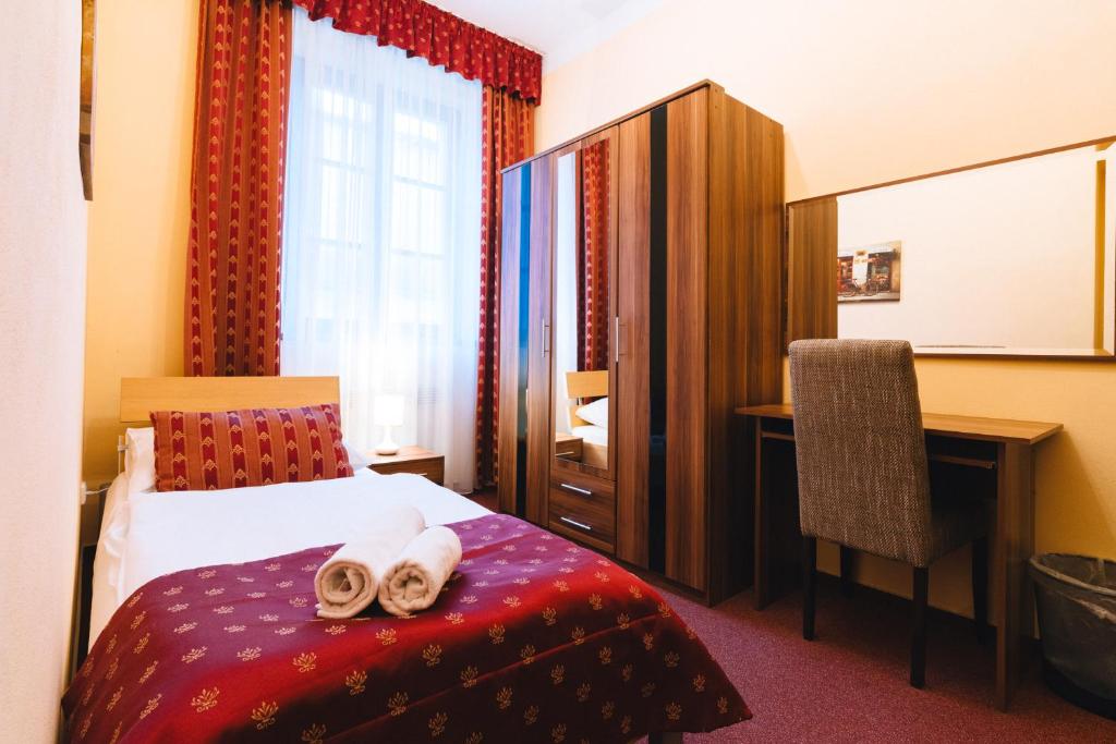 Postel nebo postele na pokoji v ubytování Elzet penzion