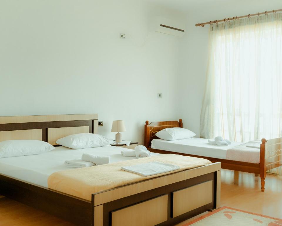 Postel nebo postele na pokoji v ubytování Guesthouse Shtino
