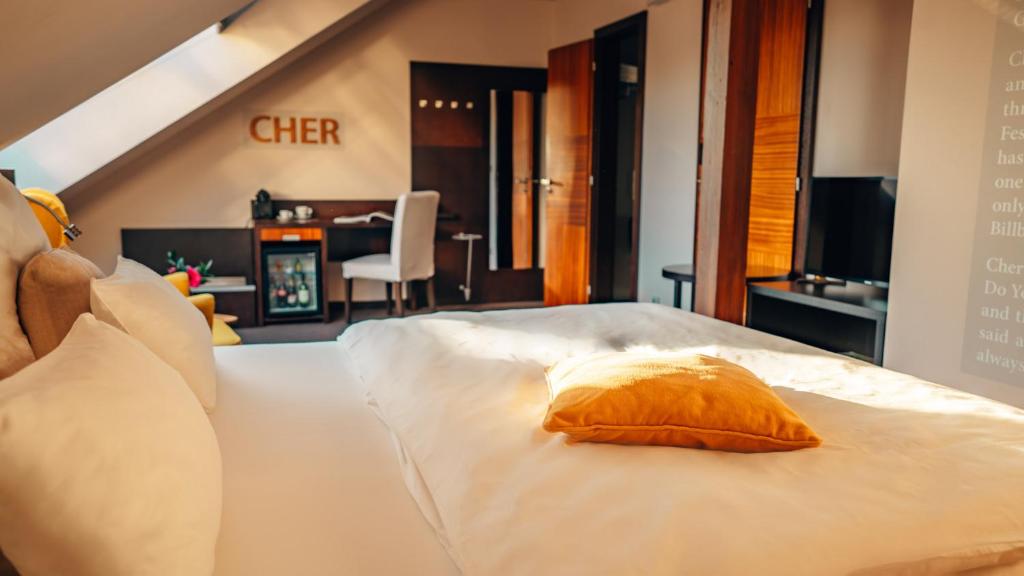 Postel nebo postele na pokoji v ubytování Boutique Hotel Klarov