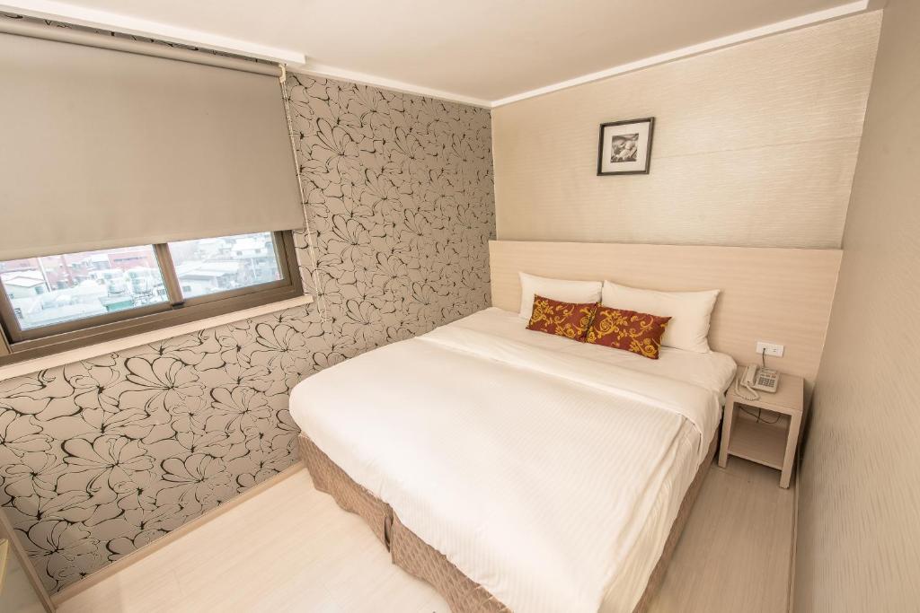 Katil atau katil-katil dalam bilik di Golden Stone Hotel