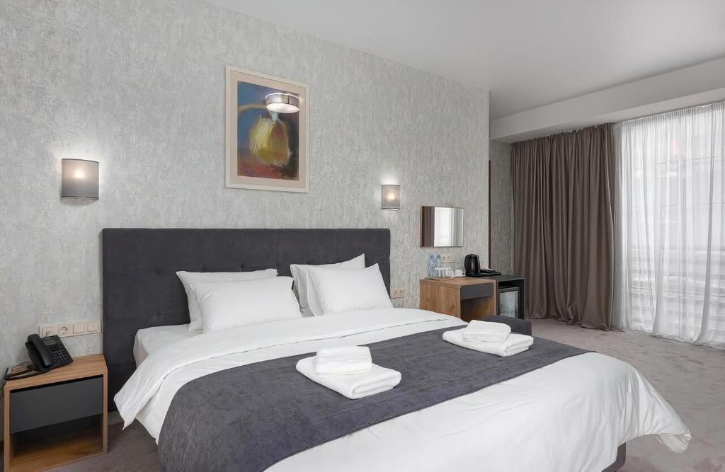 Postel nebo postele na pokoji v ubytování Hotel Flames
