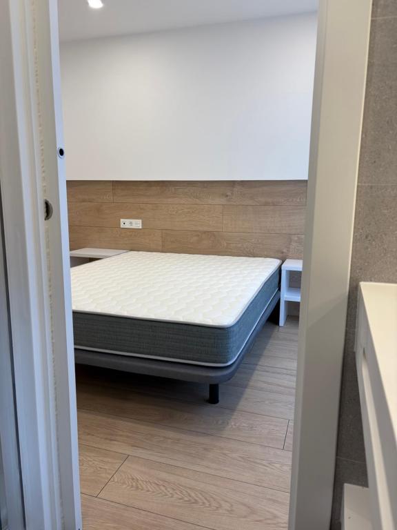 Posteľ alebo postele v izbe v ubytovaní REUSIA Apartaments