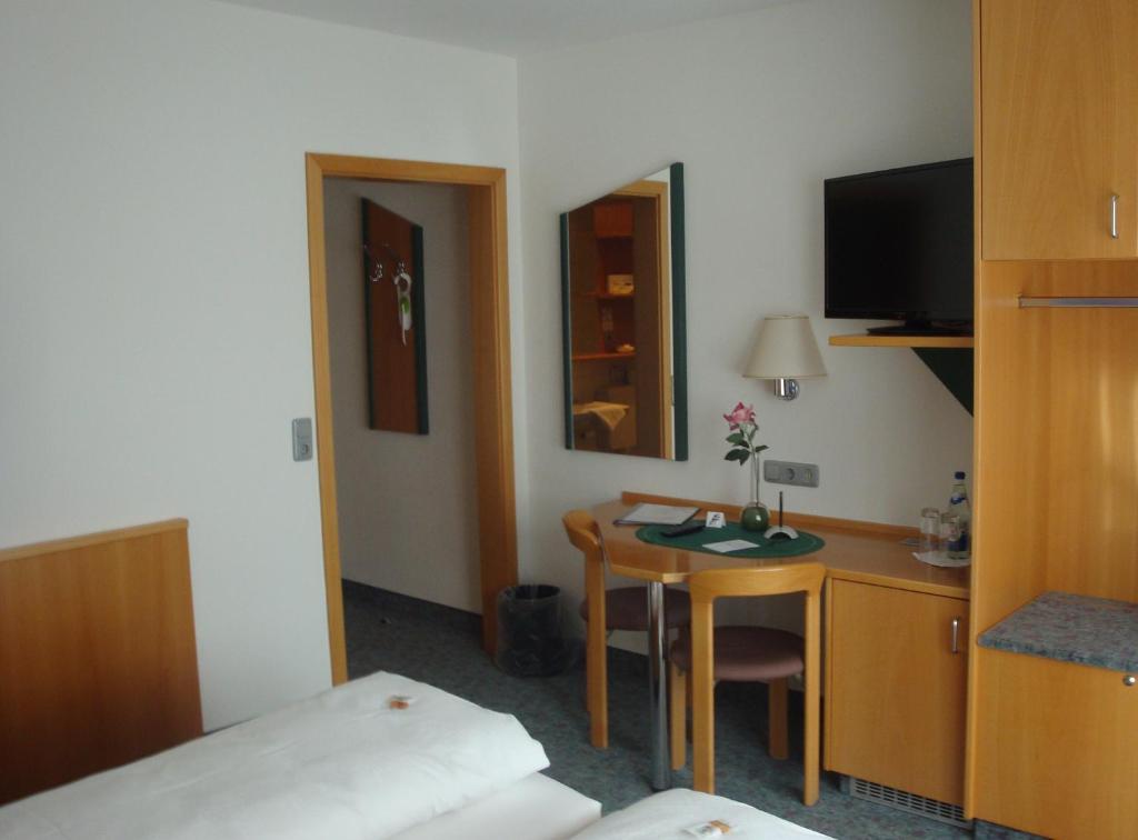 Postel nebo postele na pokoji v ubytování Hotel Restaurant zur Windmühle