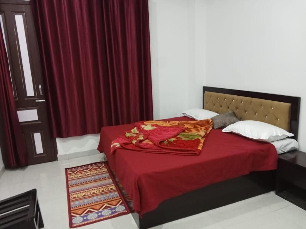 Voodi või voodid majutusasutuse Hotel Shree Ram toas