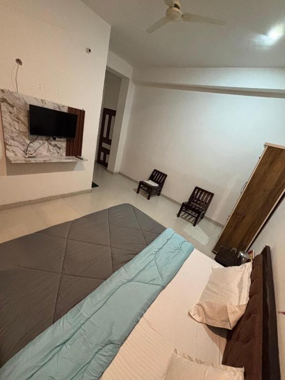 Voodi või voodid majutusasutuse Hotel Shree Ram toas