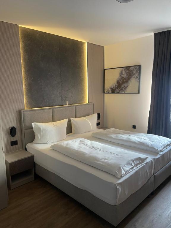 Postel nebo postele na pokoji v ubytování Hotel Heidelux