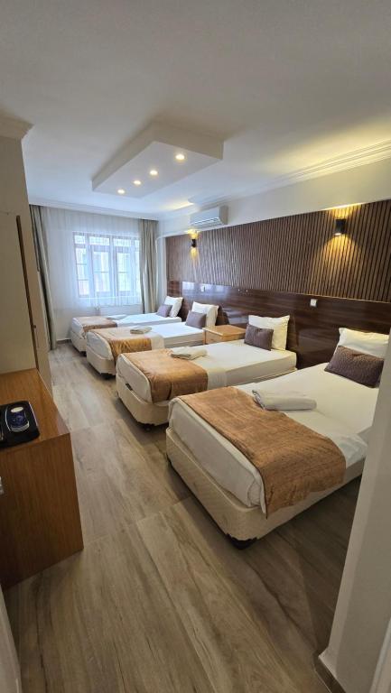 Postel nebo postele na pokoji v ubytování CLASS 17 PANSİYON