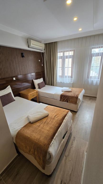 Postel nebo postele na pokoji v ubytování CLASS 17 PANSİYON