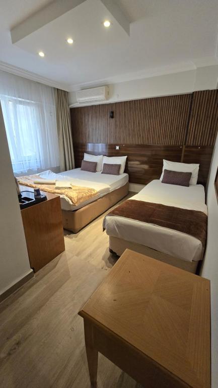 Postel nebo postele na pokoji v ubytování CLASS 17 PANSİYON