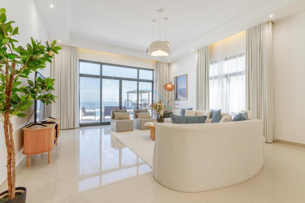 A seating area at Sea Views 4BR and Assistant's Room Villa with Heated Pool, Sharm - Al Dana Villa, Al Dana Island by Deluxe Holiday Homes