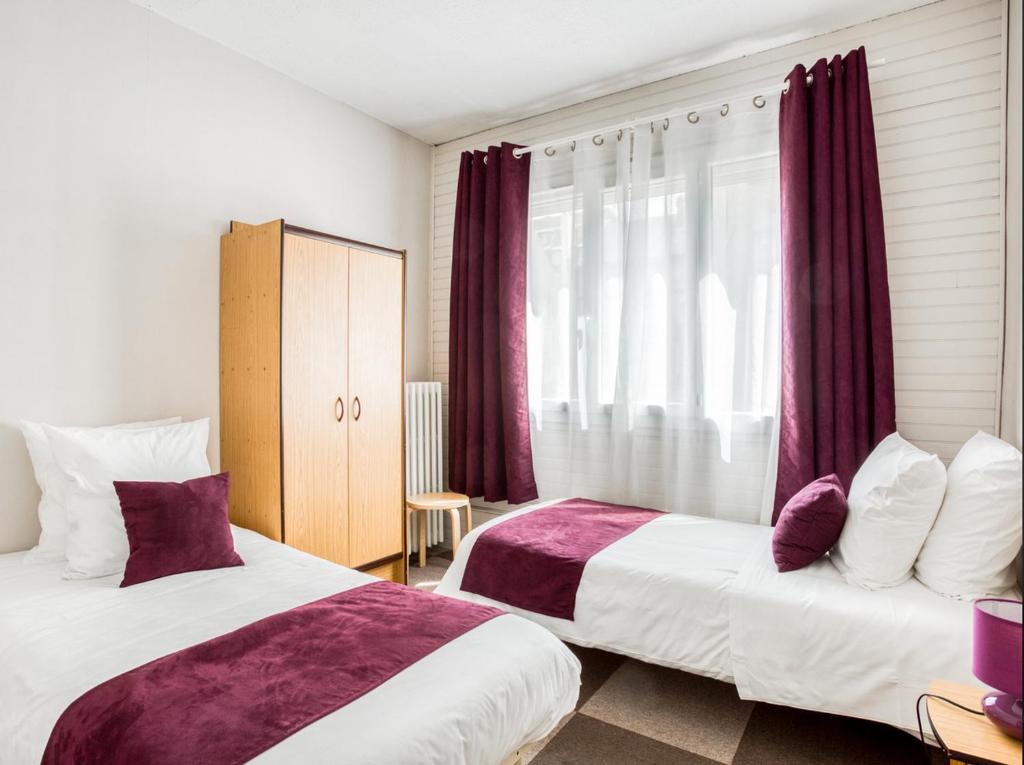 Postel nebo postele na pokoji v ubytování Logis Hôtel-Restaurant La Coupe d'Or