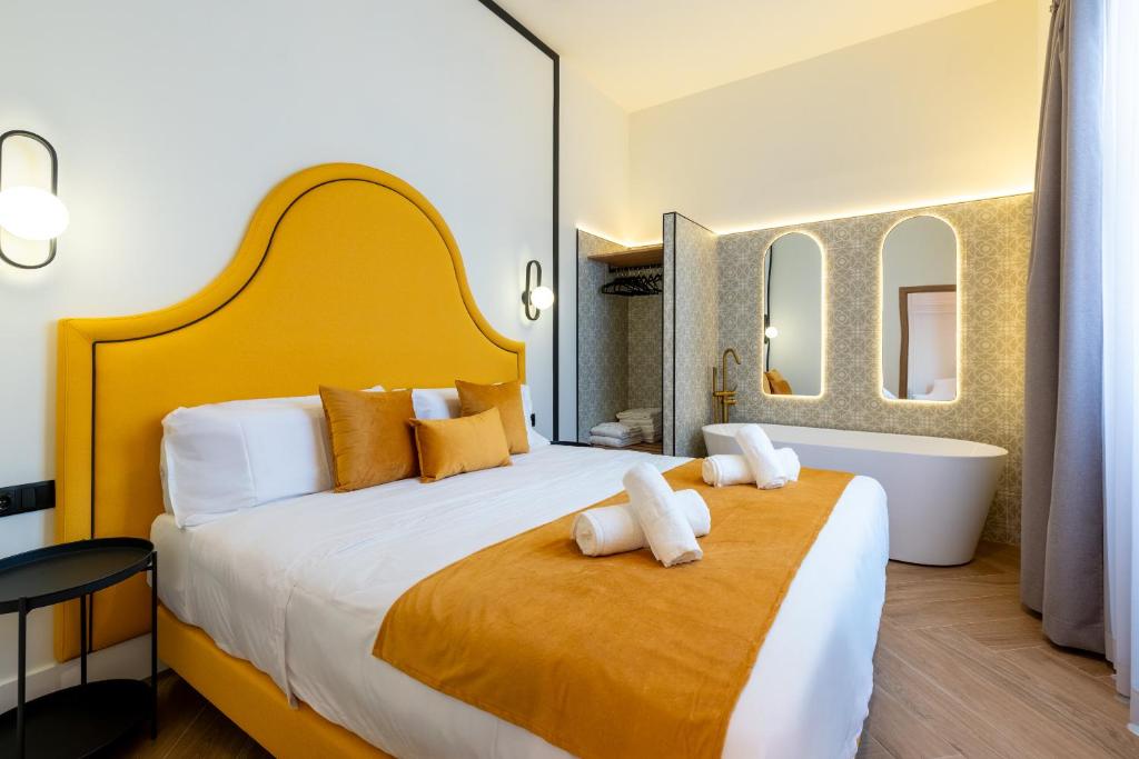 Кровать или кровати в номере Apartamentos Alvarado 5