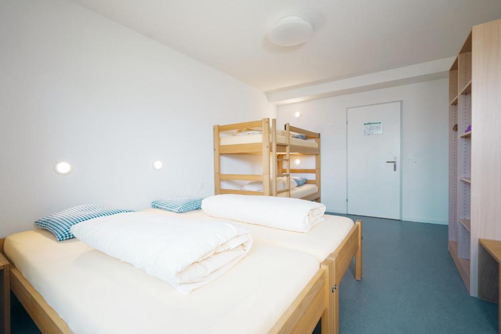 Postel nebo postele na pokoji v ubytování Schwendihaus Apartment