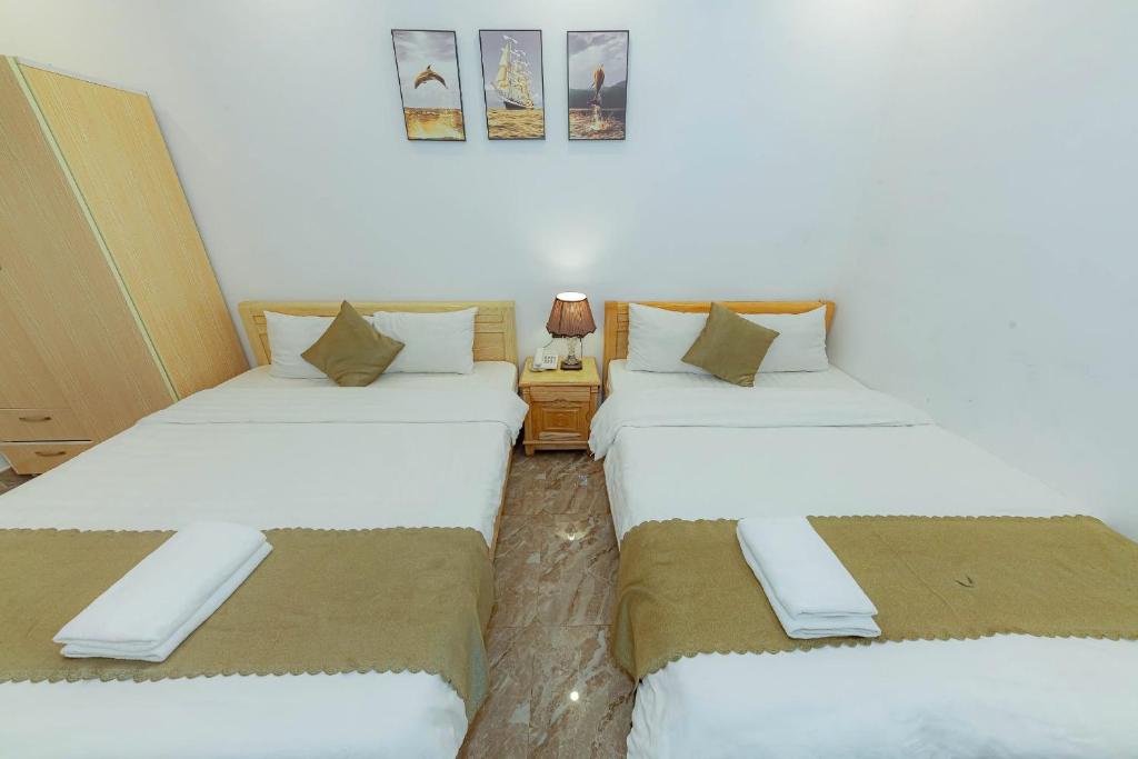 Giường trong phòng chung tại Sunrise Valley Dalat Hotel
