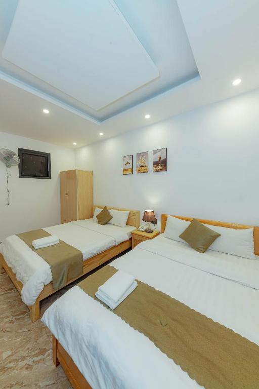 Giường trong phòng chung tại Sunrise Valley Dalat Hotel