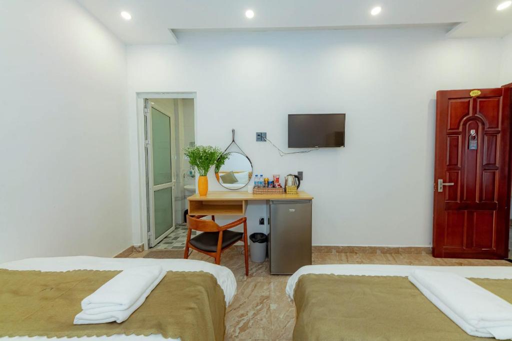 Giường trong phòng chung tại Sunrise Valley Dalat Hotel