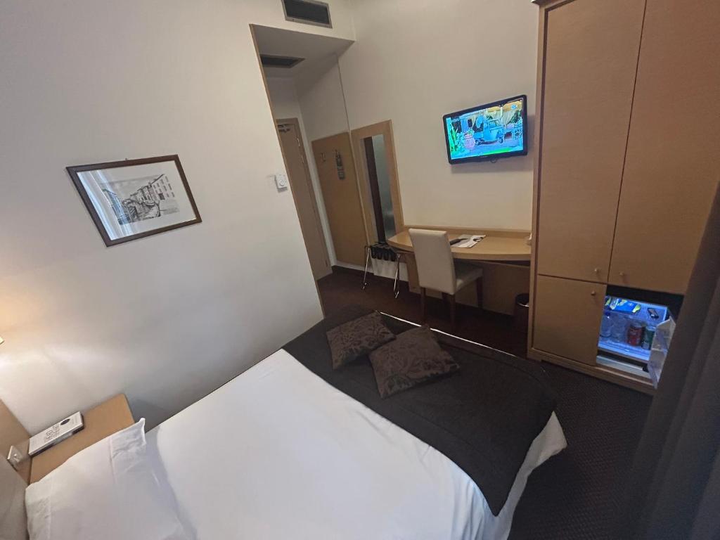 TV a/nebo společenská místnost v ubytování Hotel Vittoria