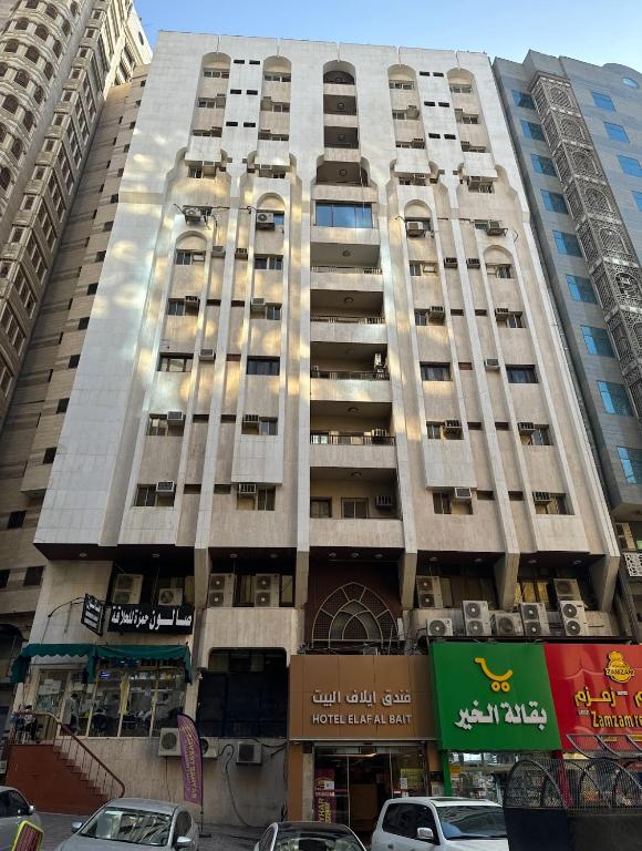 a tall building with balconies on the side of it at Elaf Al bait ايلاف البيت in Mecca