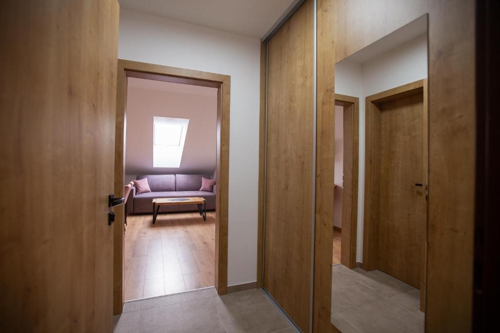 Postel nebo postele na pokoji v ubytování Apartmány Hvezdáreň
