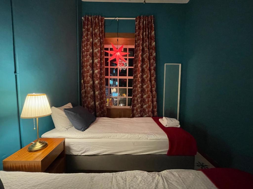 Postel nebo postele na pokoji v ubytování Hostal Bubango