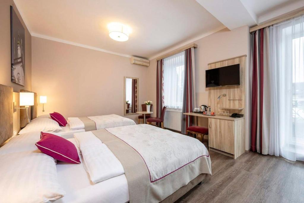 Posteľ alebo postele v izbe v ubytovaní HOTEL junior by MAX 70