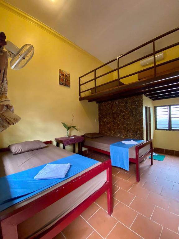 Postel nebo postele na pokoji v ubytování Derm Svay Guesthouse - yoga & cafe