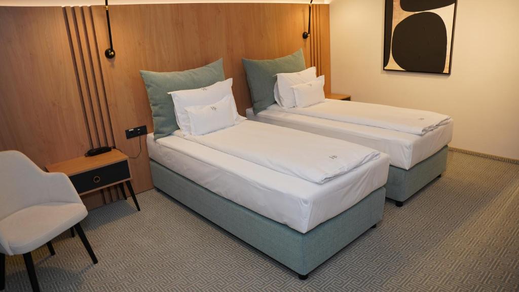 Postel nebo postele na pokoji v ubytování Hotel Sorin MIHAI