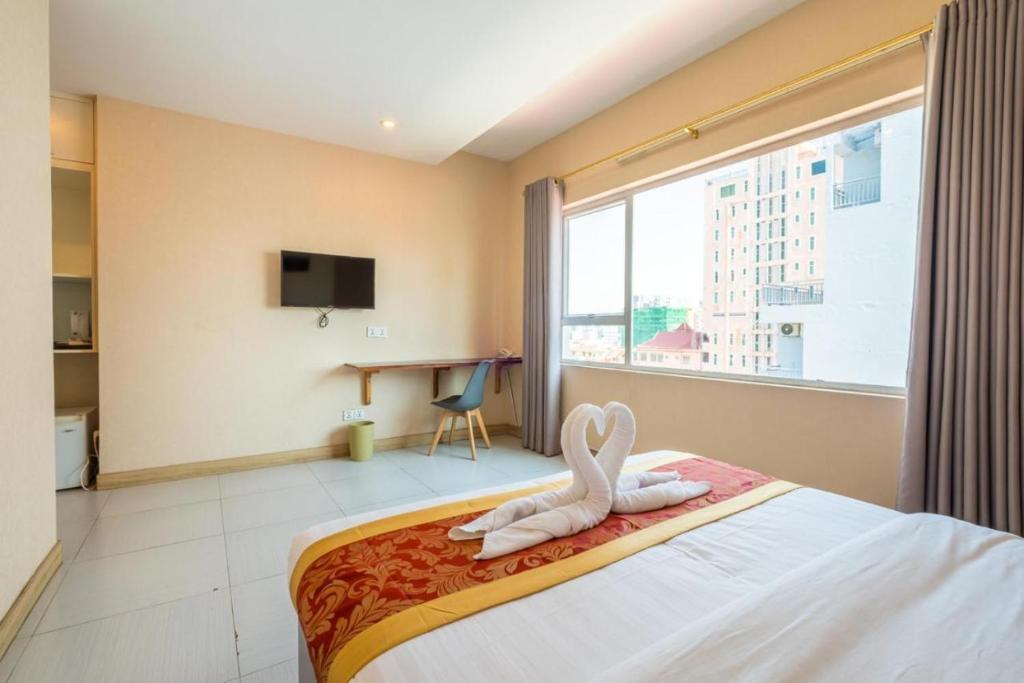 Postel nebo postele na pokoji v ubytování Colina Inn Hotel