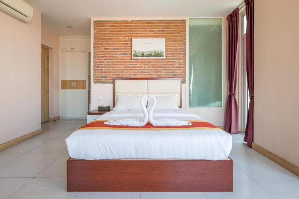 Postel nebo postele na pokoji v ubytování Colina Inn Hotel