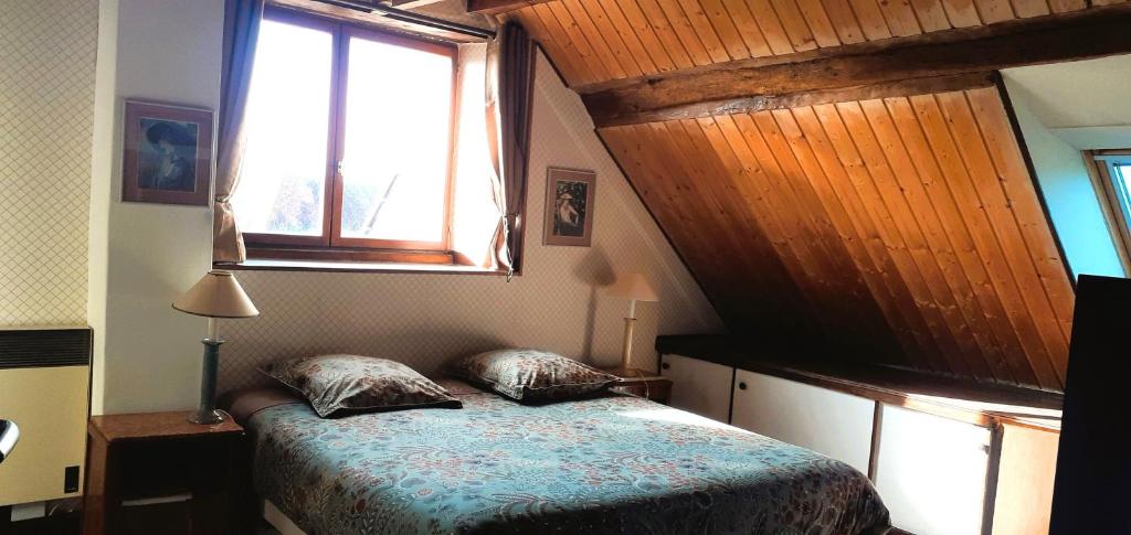 Postel nebo postele na pokoji v ubytování Au verger de Marcilly