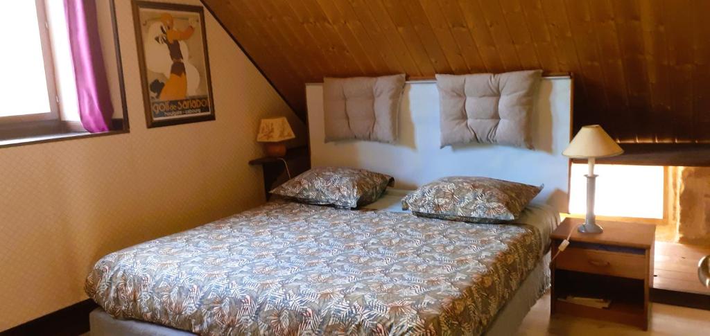 Postel nebo postele na pokoji v ubytování Au verger de Marcilly