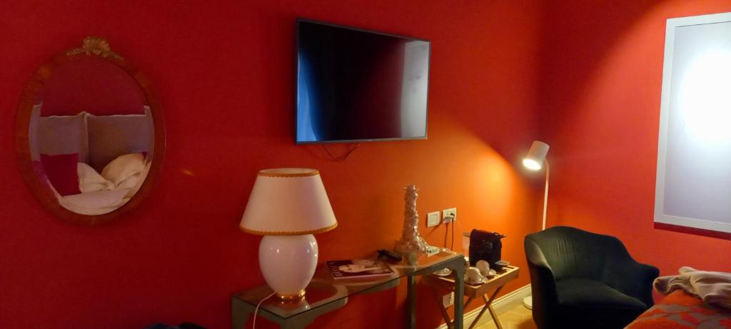 TV a/nebo společenská místnost v ubytování Palazzo Caruso