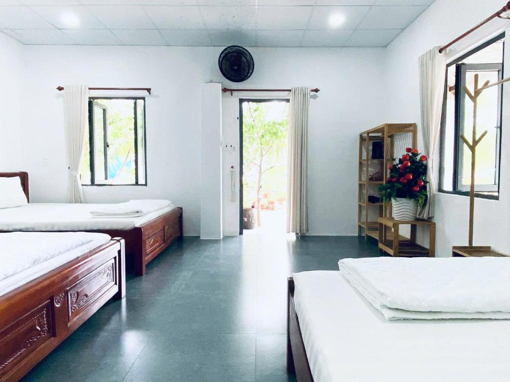Ένα ή περισσότερα κρεβάτια σε δωμάτιο στο May's House An Chấn