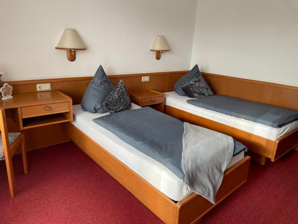 Postel nebo postele na pokoji v ubytování Hotel Blocksberg