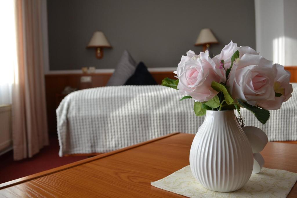 Postel nebo postele na pokoji v ubytování Hotel Blocksberg