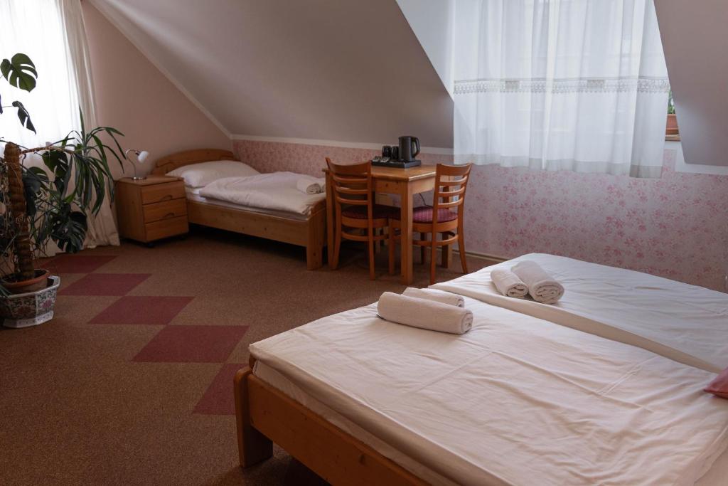 Postel nebo postele na pokoji v ubytování Martinov Hram