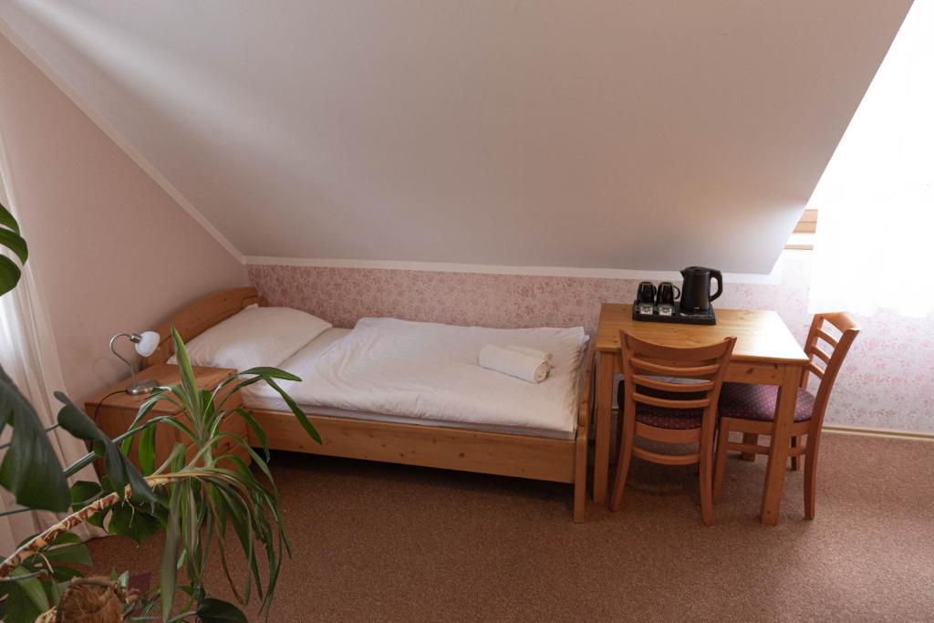 Postel nebo postele na pokoji v ubytování Martinov Hram