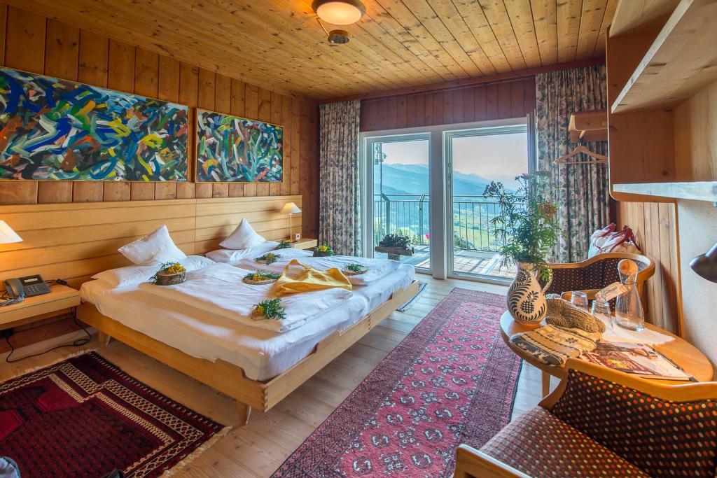 Postel nebo postele na pokoji v ubytování Biohotel Grafenast