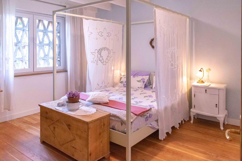 Postel nebo postele na pokoji v ubytování Grande Appartamento sulle Dolomiti