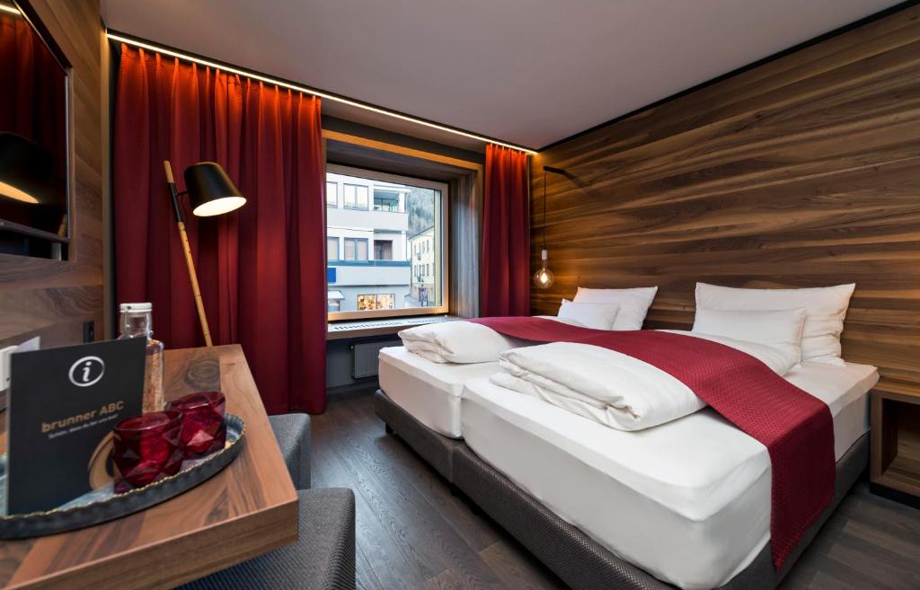 Postel nebo postele na pokoji v ubytování Stadthotel Brunner