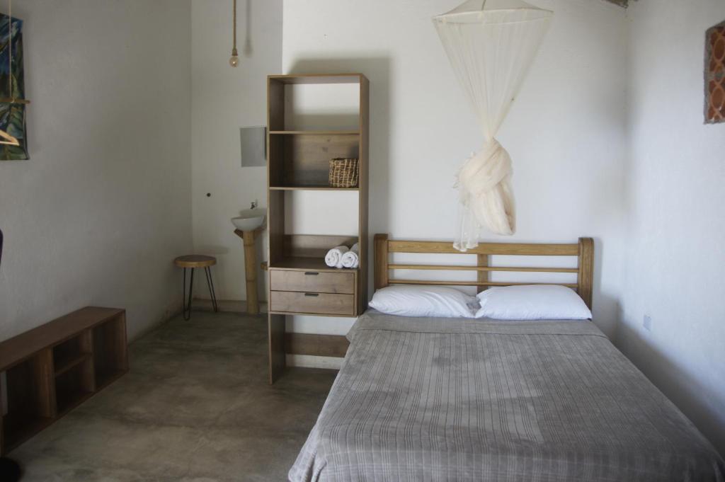 Postel nebo postele na pokoji v ubytování Hostal Vista Verde Minca