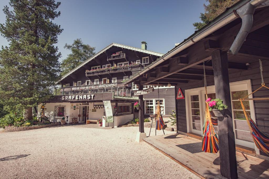 a large building with a store in the front of it at Biohotel Grafenast in Pill