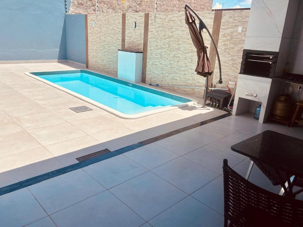 Πισίνα στο ή κοντά στο Casa azul da patroa