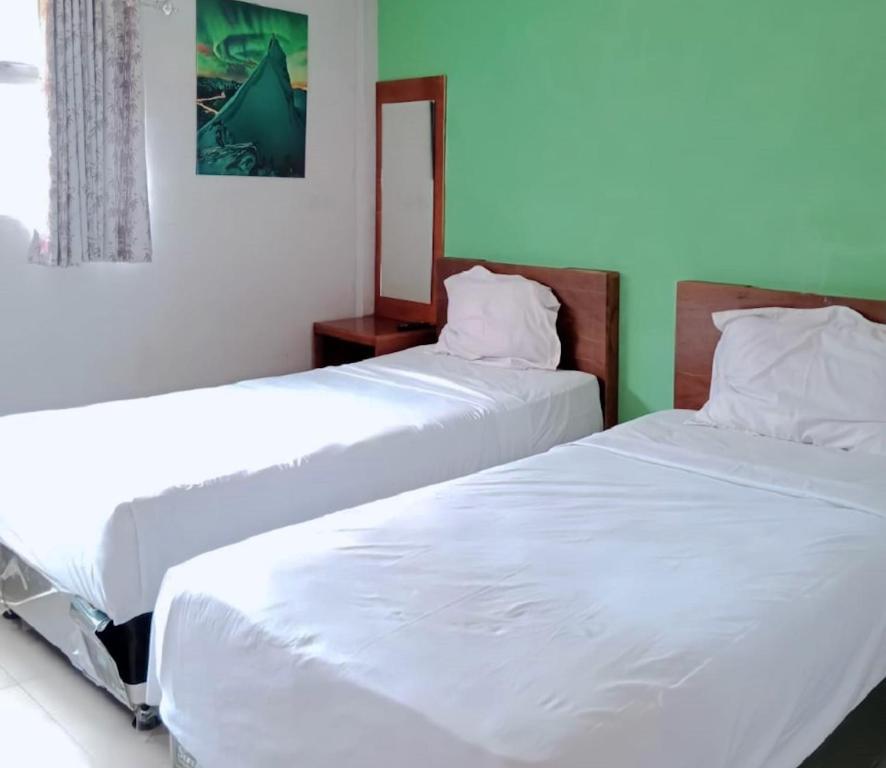 Letto o letti in una camera di The Aurora by Makati