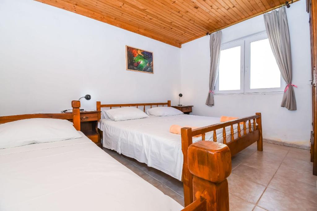 Posteľ alebo postele v izbe v ubytovaní Apartment Doktor
