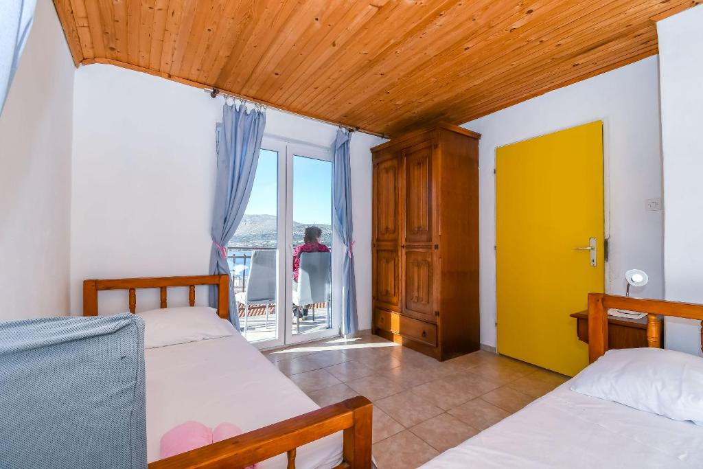 Posteľ alebo postele v izbe v ubytovaní Apartment Doktor
