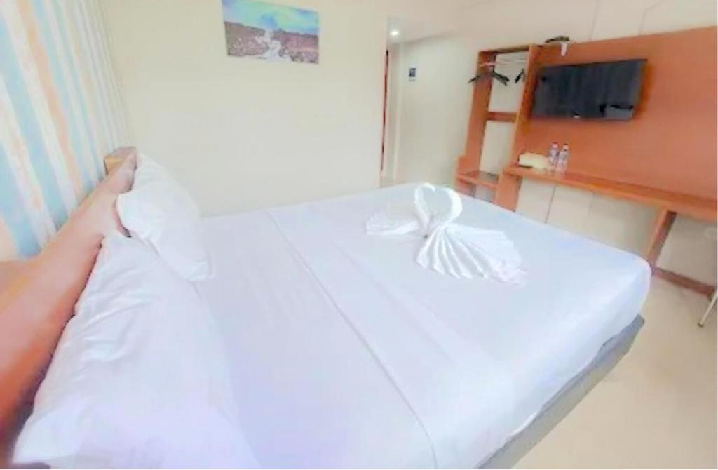 Letto o letti in una camera di The Aurora by Makati