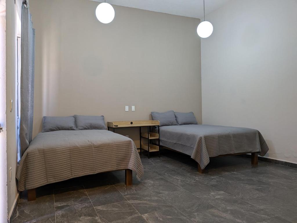 Postel nebo postele na pokoji v ubytování Lofts Sayula Independencia
