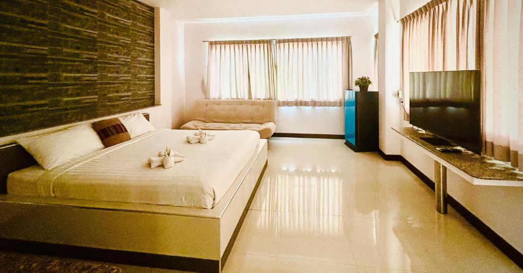 Giường trong phòng chung tại Ree- Riverside hotel