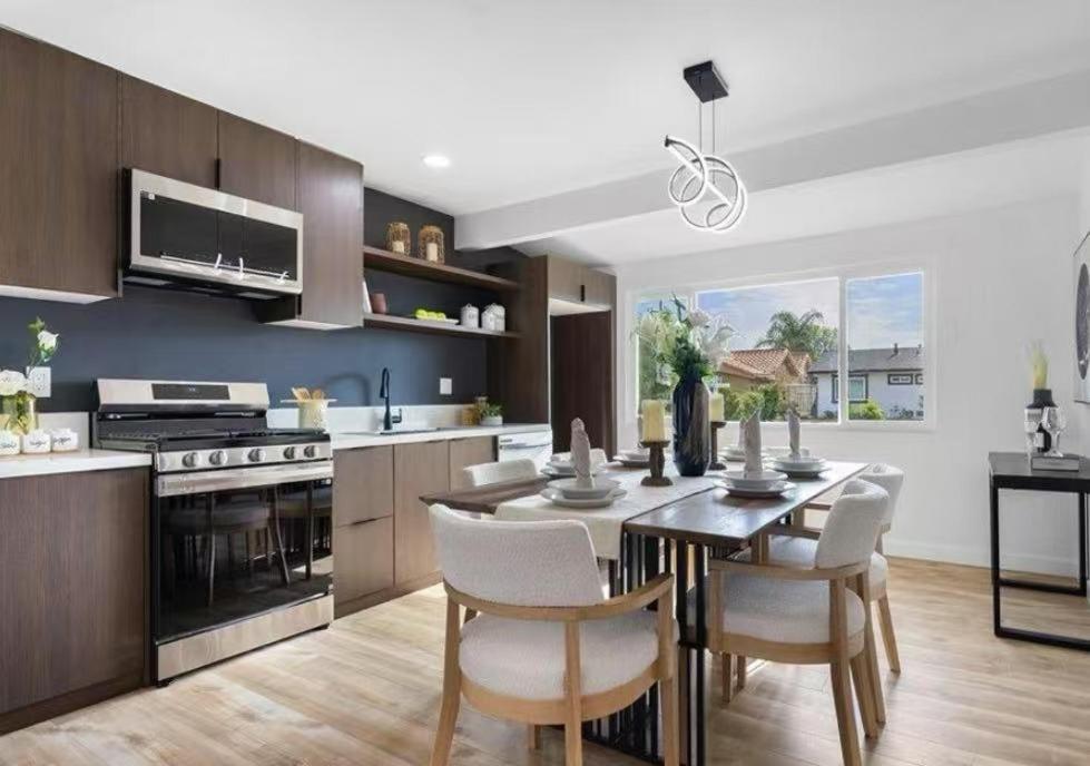 a kitchen and dining room with a table and chairs at Cozy beautiful house in Glendora